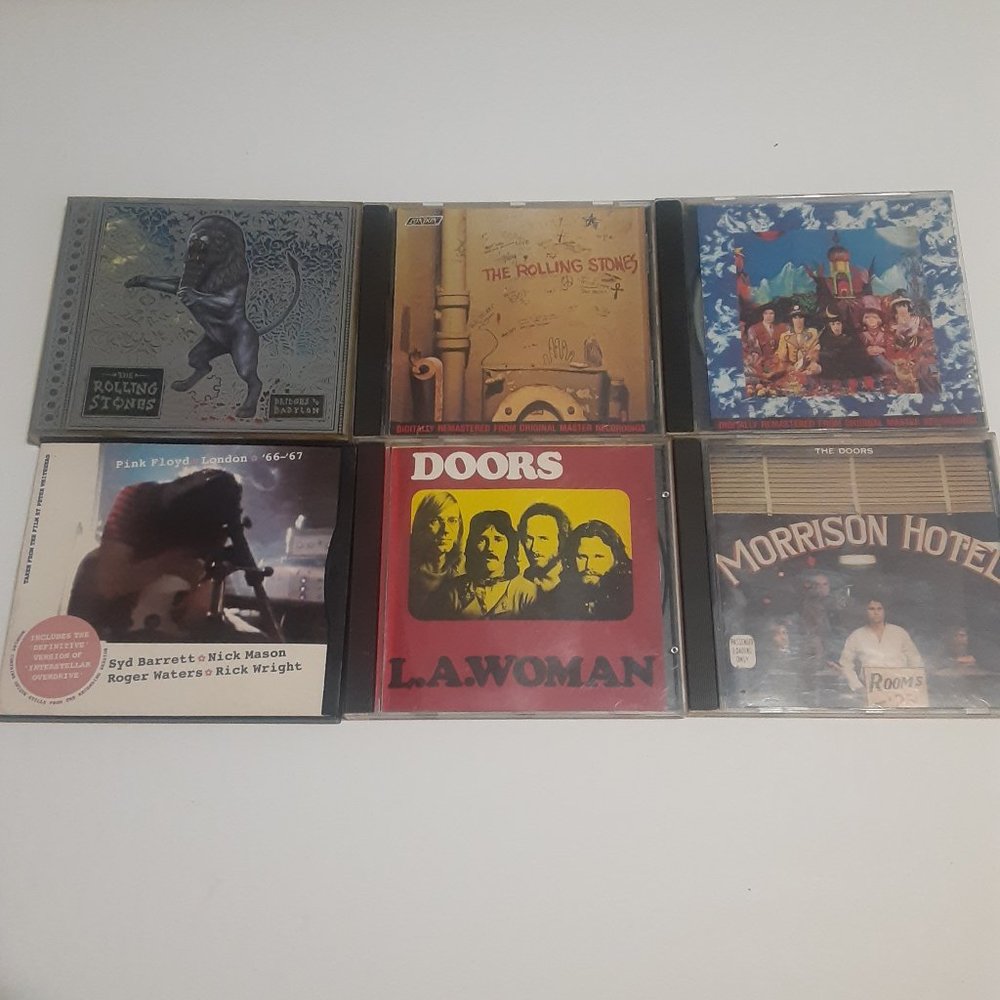 6 Vintage CD'S Including The Rolling Stones,  The Doors, and Pink Floyd